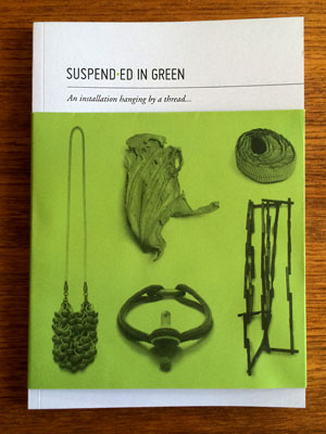 Suspended in green